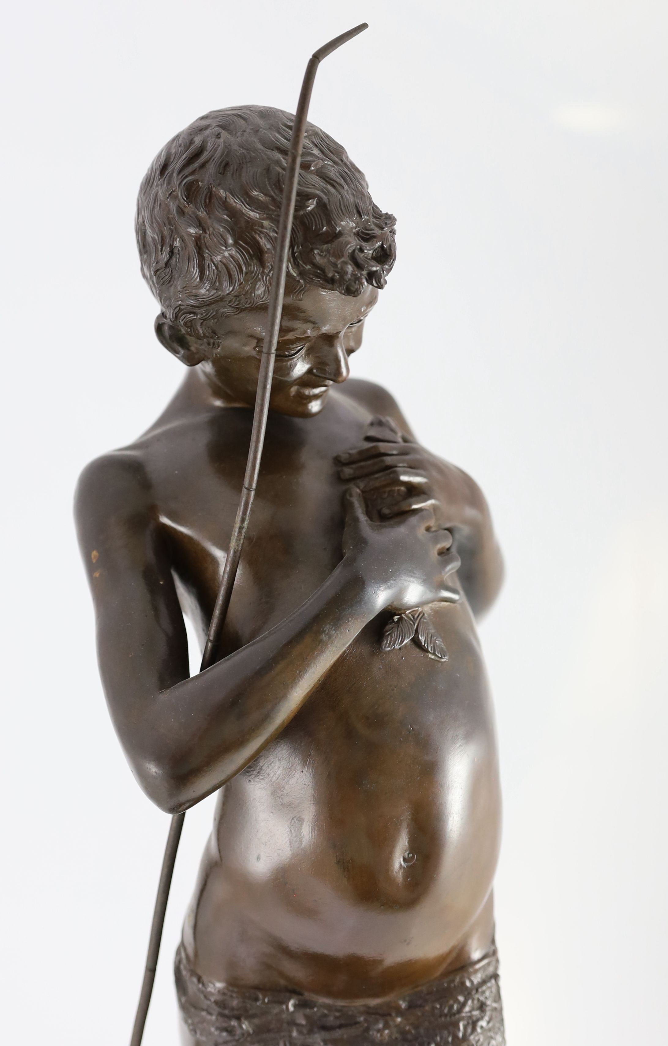 Giovanni Varlese (Italian, 1888-1922). A bronze figure of a fisherboy standing holding a fish to his chest, height 72cm